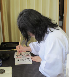 Priestess Calligraphing Goshuin